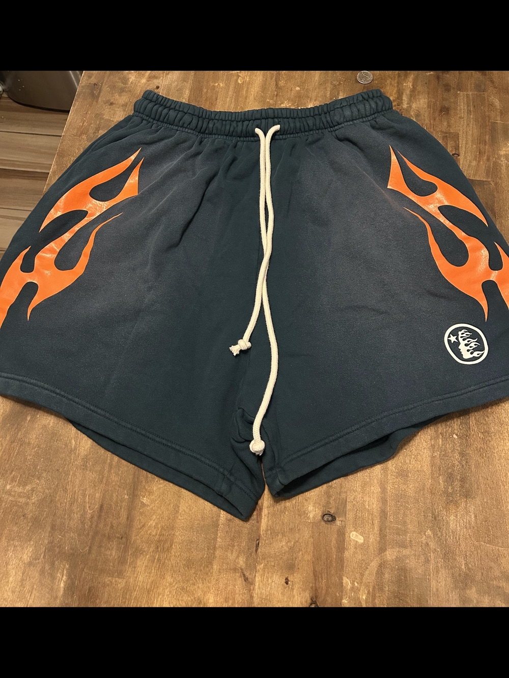 Hellstar Studios Green Shorts Orange Flame Graphic